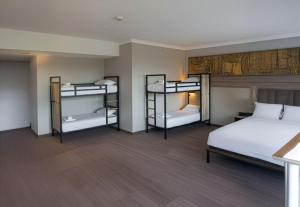 Ένα ή περισσότερα κρεβάτια σε δωμάτιο στο a&o London Docklands Riverside +11 φωτογραφίες