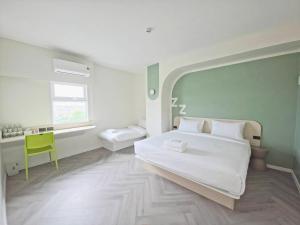 Ένα ή περισσότερα κρεβάτια σε δωμάτιο στο ezzenhotel Phitsanulok