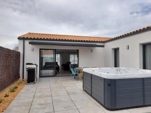 Patio nebo venkovní prostory v ubytování Villa avec SPA 5 places