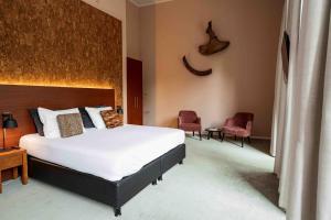 Ένα ή περισσότερα κρεβάτια σε δωμάτιο στο Leerhotel Het Klooster