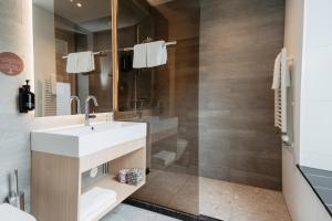 a bathroom with a sink and a shower at Leerhotel Het Klooster in Amersfoort +19 photos