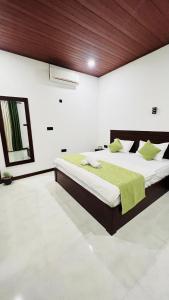 En eller flere senge i et værelse på Peacock Garden