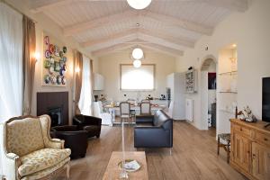 a living room with furniture and a dining room at AD MY HOME in Cortona