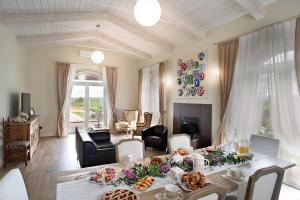 a living room with a table with food on it at AD MY HOME in Cortona