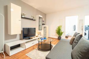 Μια τηλεόραση ή/και κέντρο ψυχαγωγίας στο Gemütliches Apartment nähe Bahnhof und Hochschule