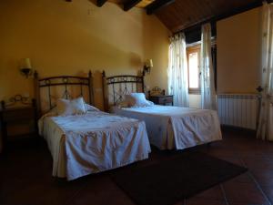 Postel nebo postele na pokoji v ubytování Hostal EL MESON