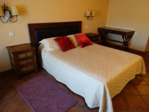 Postel nebo postele na pokoji v ubytování Hostal EL MESON + 6 fotografií