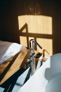 Ένα ή περισσότερα κρεβάτια σε δωμάτιο στο Bellhop Tbilisi