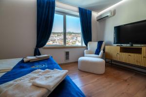 En eller flere senge i et værelse på Panorama City View - Tsar Kaloyan