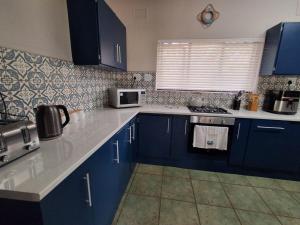 Η κουζίνα ή μικρή κουζίνα στο Serendipity Beach House +10 φωτογραφίες