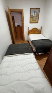 Ένα ή περισσότερα κρεβάτια σε δωμάτιο στο Poseidón