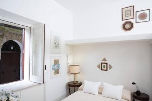 Ένα ή περισσότερα κρεβάτια σε δωμάτιο στο La Dimora del Re