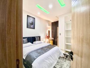 a bedroom with a large bed in a room at House 8 in Lekki +74 photos