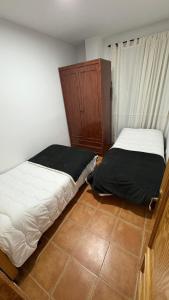 Ένα ή περισσότερα κρεβάτια σε δωμάτιο στο Poseidón +1 φωτογραφίες