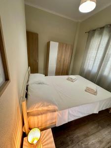 Postel nebo postele na pokoji v ubytování ESTIA Apollon