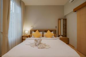 Ένα ή περισσότερα κρεβάτια σε δωμάτιο στο Jinju little house