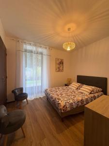 Кровать или кровати в номере Gîte des Milandes - vue imprenable sur le château