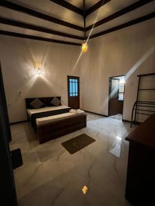 a bedroom with a bed in a room at Villa Amore in Ahangama