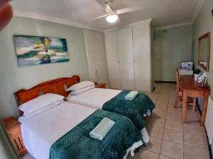 Ένα ή περισσότερα κρεβάτια σε δωμάτιο στο New Eden Suites