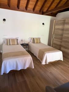 En eller flere senge i et værelse på Casa Vista Valle