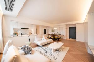 a living room with a couch and a table at Pure home-Shanghai core high-floor house, large area, near Yuyuan Garden, the Bund People's Square,Commanding Panoramic Night of the Pearl Tower,Enjoying the stunning views of the Bund in Shanghai