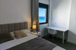 En eller flere senge i et værelse på Blue Suites 204 + 25 billeder