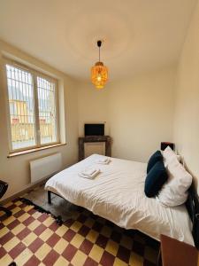 Postel nebo postele na pokoji v ubytování La pause du vignoble