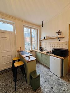 Kuchyň nebo kuchyňský kout v ubytování La pause du vignoble