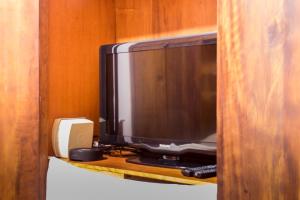 TV a/nebo společenská místnost v ubytování Villa Bem Querer - Suíte