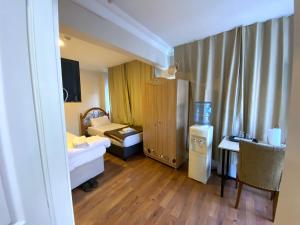 Postel nebo postele na pokoji v ubytování Meydan Pansiyon Uskudar