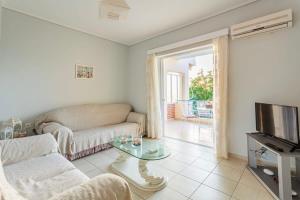 Μια τηλεόραση ή/και κέντρο ψυχαγωγίας στο Seaview Terrace Haven-Perfect Location By The Sea