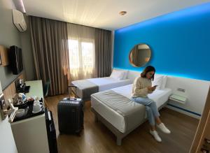 Una cama o camas en una habitación de My Dora Hotel 26 fotos más