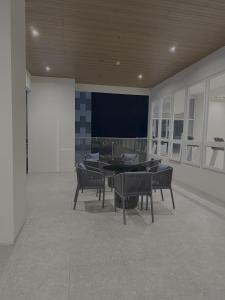 a group of tables and chairs in a room at Sitari Condo Bacolod in Bacolod +4 photos