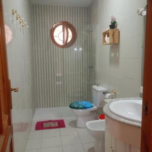 a bathroom with a toilet and a sink at Carboneras, la Mar Divina in Carboneras