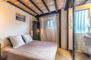 Ένα ή περισσότερα κρεβάτια σε δωμάτιο στο Lakaz - Loft à Seignosse