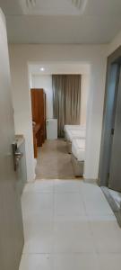 a room with two beds and a room with a hallway at فندق دار المتكاملة 4 in Al Khansāk +38 photos