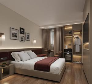 a bedroom with a large bed and a dressing room at Atlantis Alger Aeroport ex Ibis in Alger +58 photos