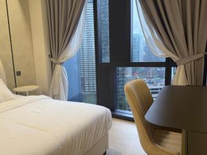 Ένα ή περισσότερα κρεβάτια σε δωμάτιο στο Star Residance KLCC +30 φωτογραφίες