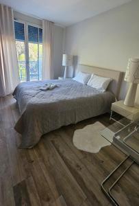 Voodi või voodid majutusasutuse Penthouse Vichy - Résidence luxueuse à Vichy toas +7 fotot