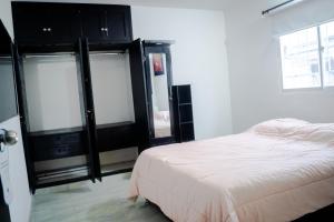 Кровать или кровати в номере Aparta Estudio Amoblado 1 a 3 Personas