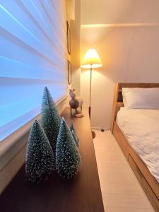 En eller flere senge i et værelse på Maro Stay Songpa