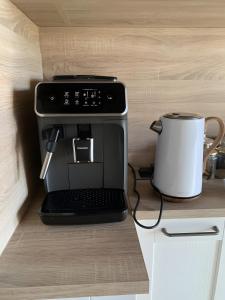 Kuchyň nebo kuchyňský kout v ubytování Chambres d'hôtes Exotique + 5 fotografií