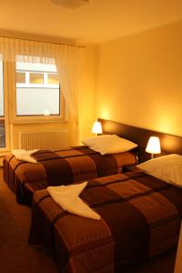 Postel nebo postele na pokoji v ubytování Hotel Aqua