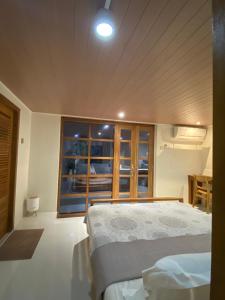 Ένα ή περισσότερα κρεβάτια σε δωμάτιο στο NOBE Villas