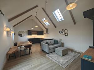 a living room with a couch and a table at 1 Bed in Castleton oc-t34011 in Castleton
