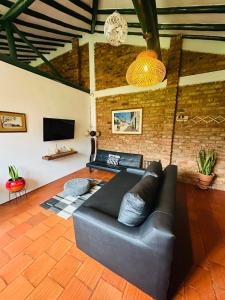 TV a/nebo společenská místnost v ubytování Villa San Carlos-Casa familiar con amplio Jardín