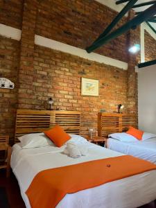 Postel nebo postele na pokoji v ubytování Villa San Carlos-Casa familiar con amplio Jardín