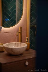 a sink in a bathroom with a mirror at Le Boudoir in Vallauris +7 photos