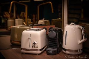 two toasters sitting on top of a table at Le Boudoir in Vallauris