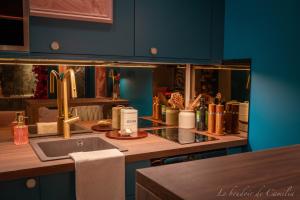 a kitchen with a counter with a sink and a counter top at Le Boudoir in Vallauris